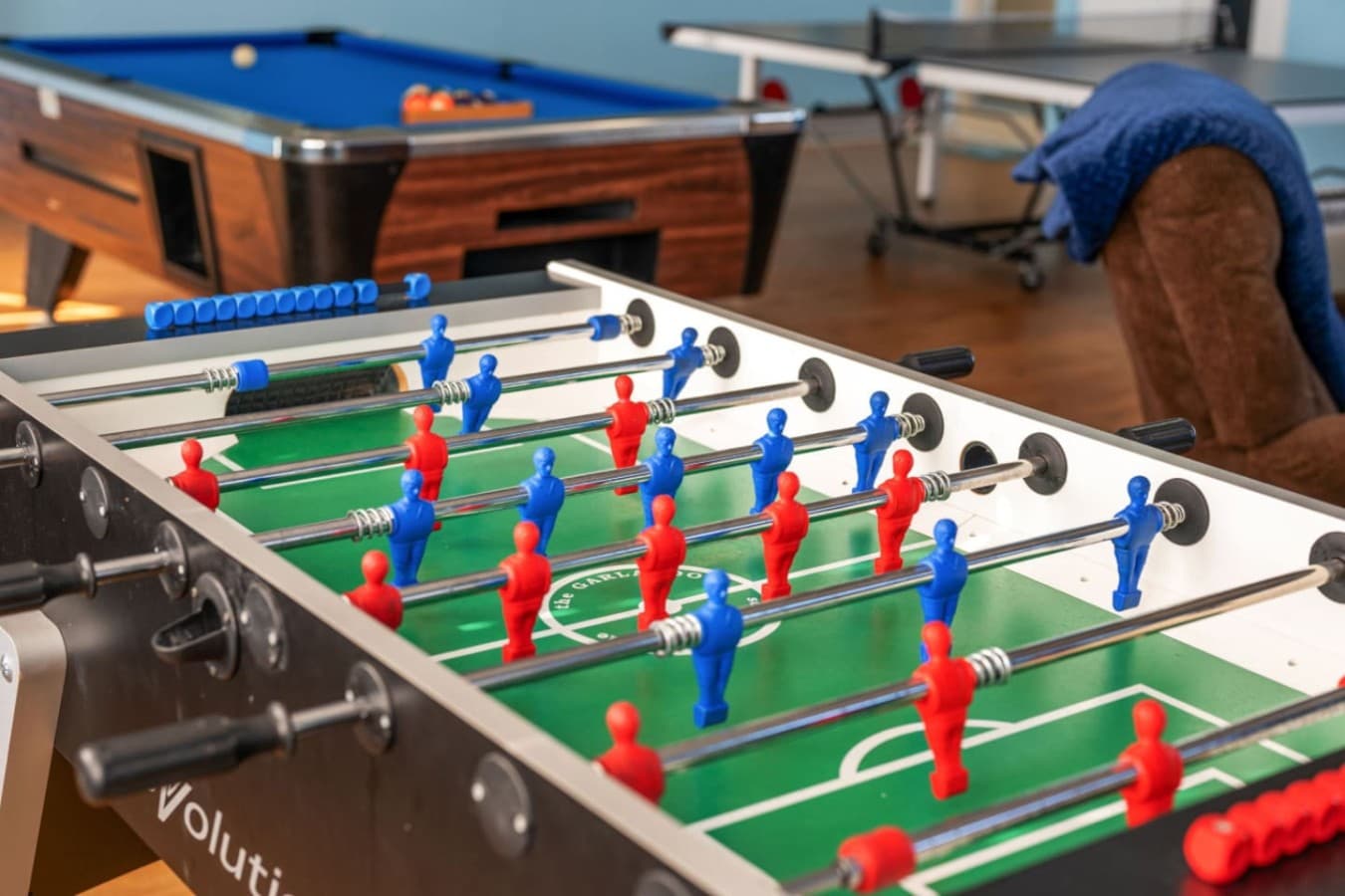 Foosball table ready for friendly matches & laid-back game nights indoors.