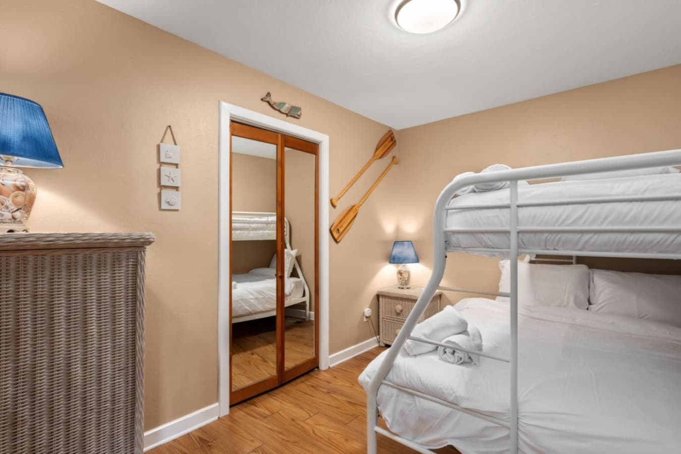Bunk room w/ stacked beds & playful decor, great for kids or extra guests.