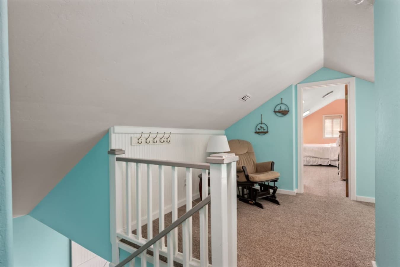 Upper-level nook w/ desk space & playful coastal colors, a quiet corner to focus or unwind.