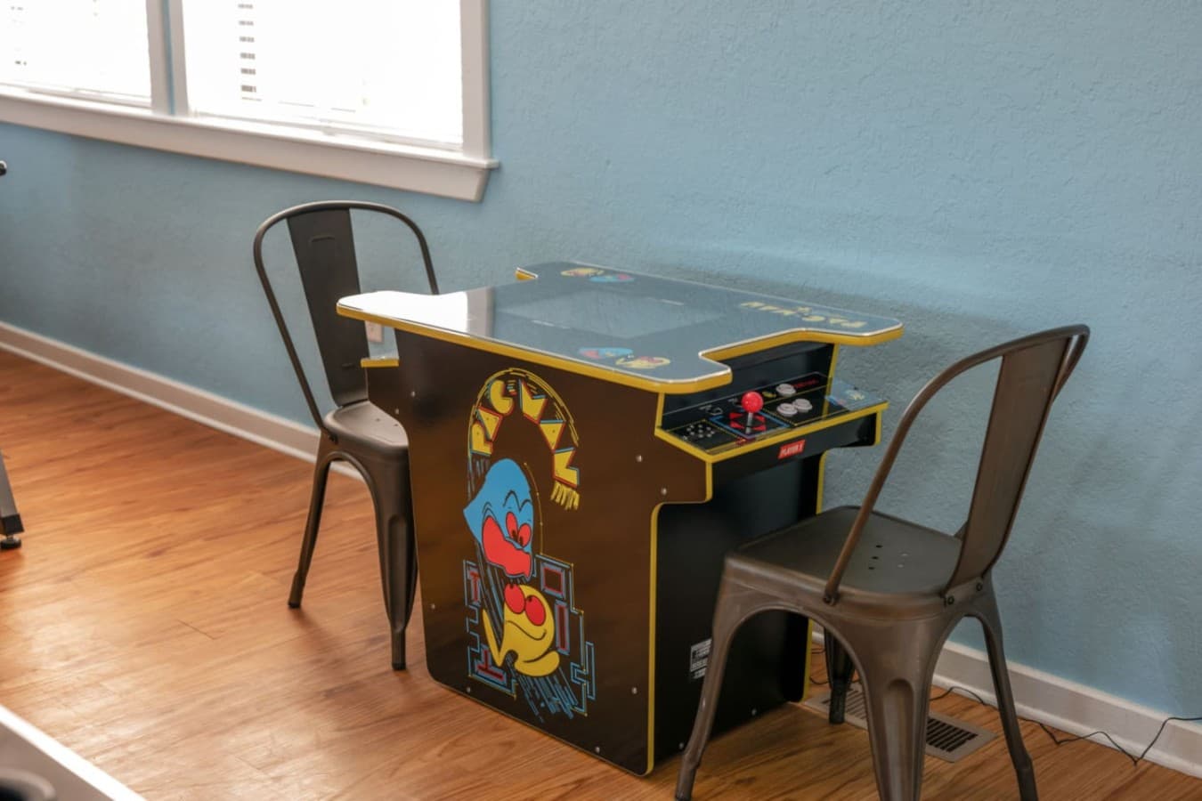 Kids table w/ colorful seating, a fun spot for games, crafts, or snacks.