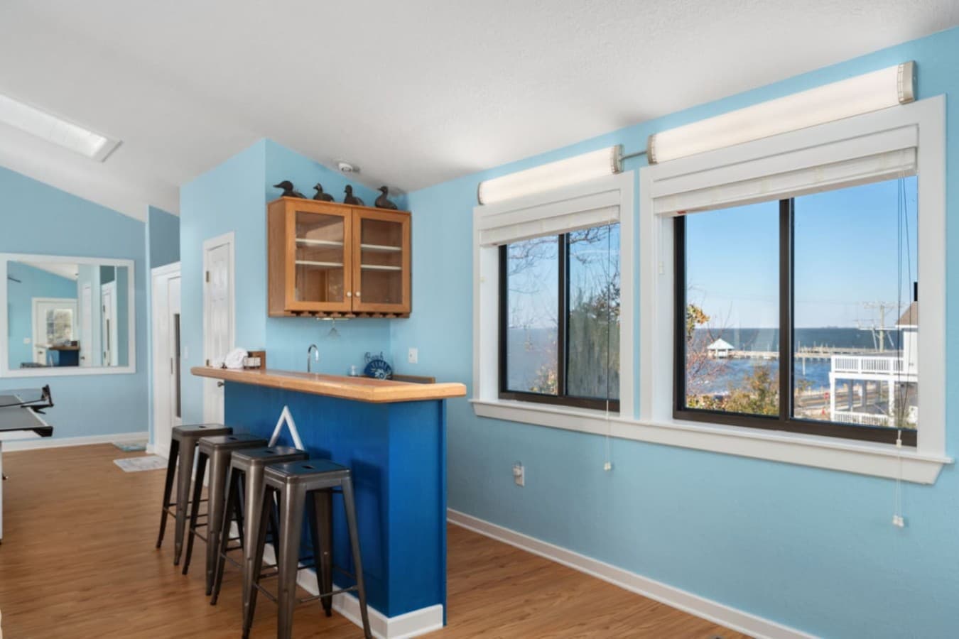 Bright kitchen corner w/ sound peeks & cheerful blue accents.