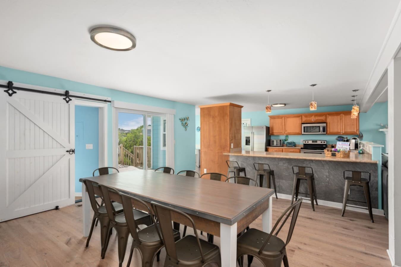 Open-concept kitchen & living area w/ bar seating & easy flow for group hangouts.