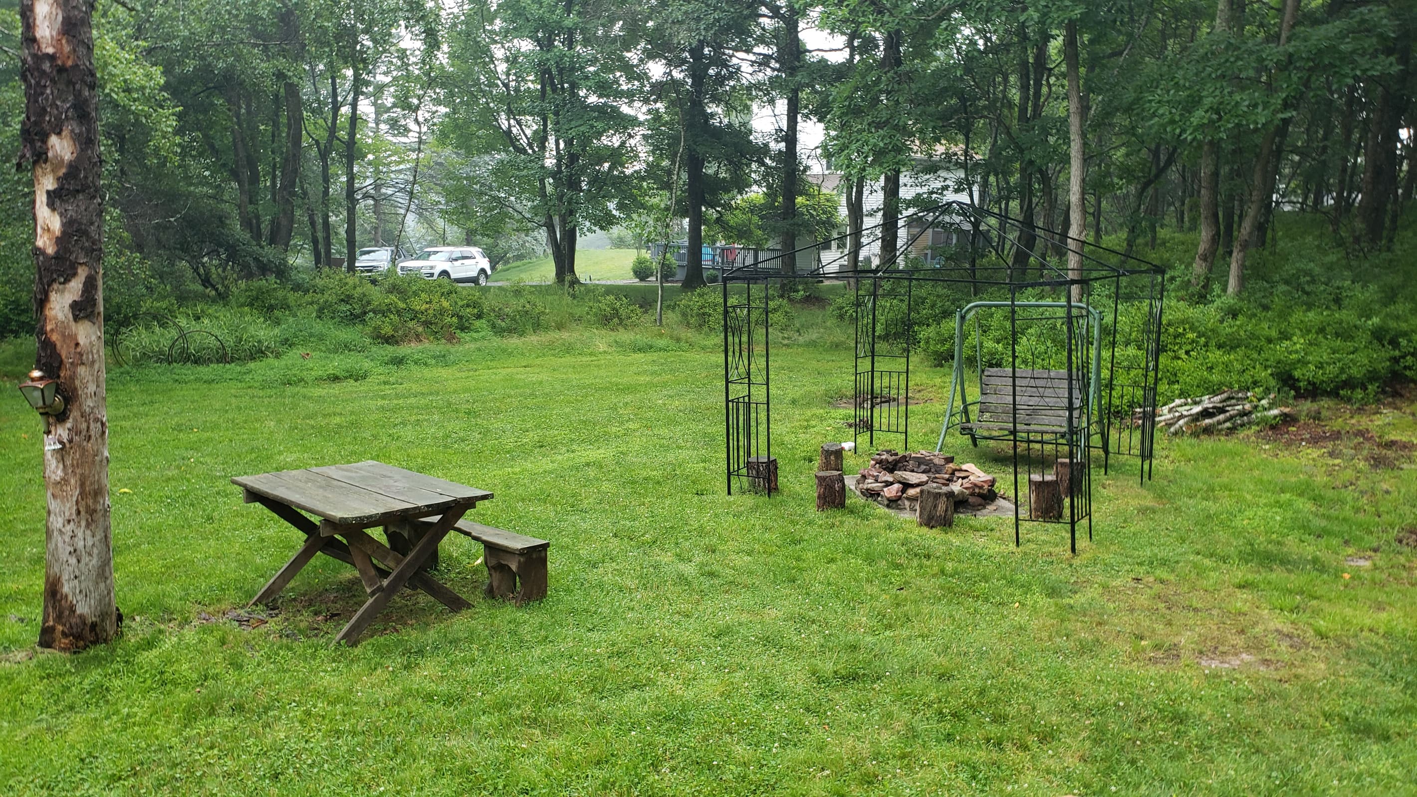 Large  backyard with cozy fire pit