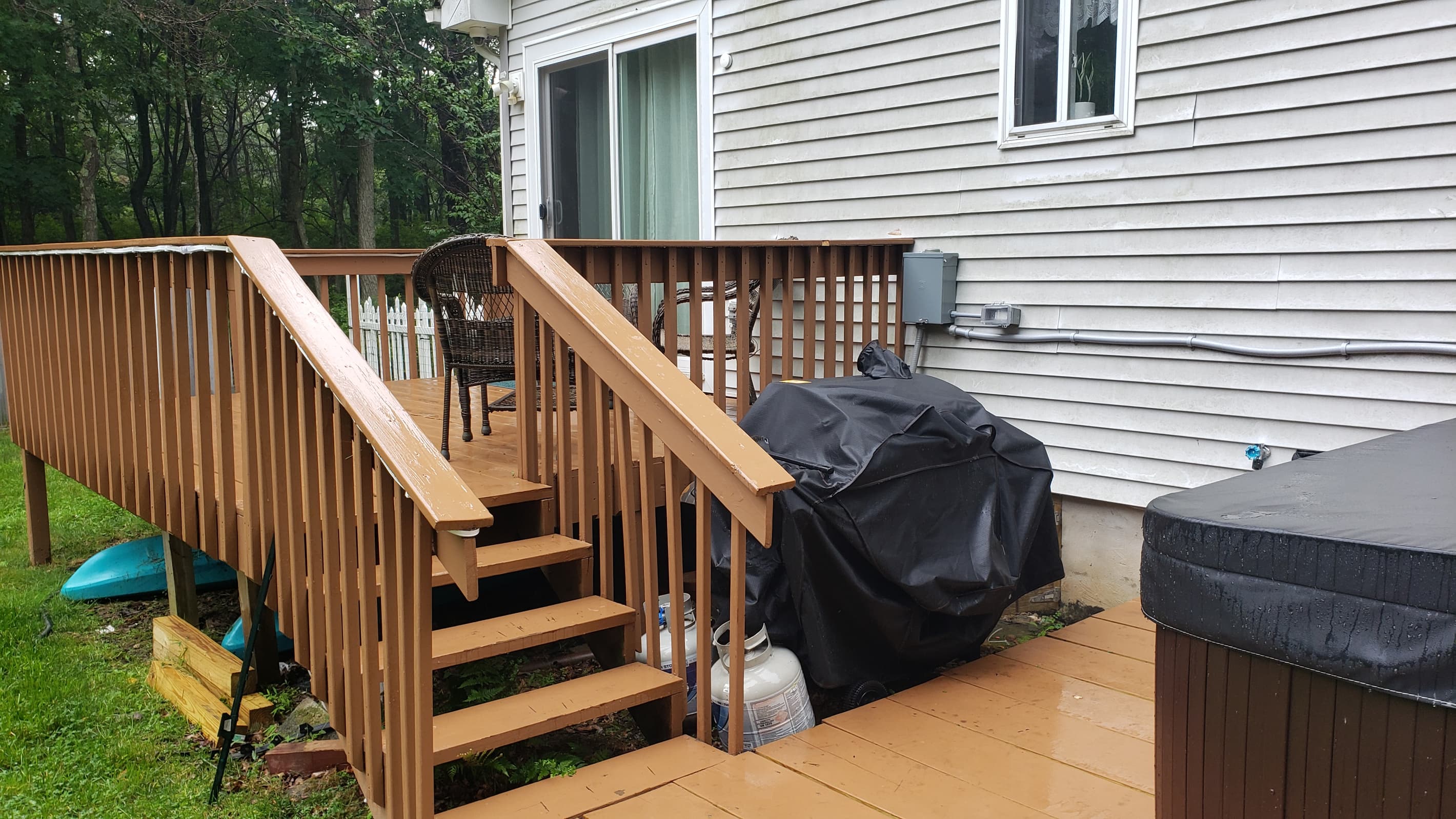 Back deck with seating; perfect for conversation or gathering. Gas Grill with Propane provided!