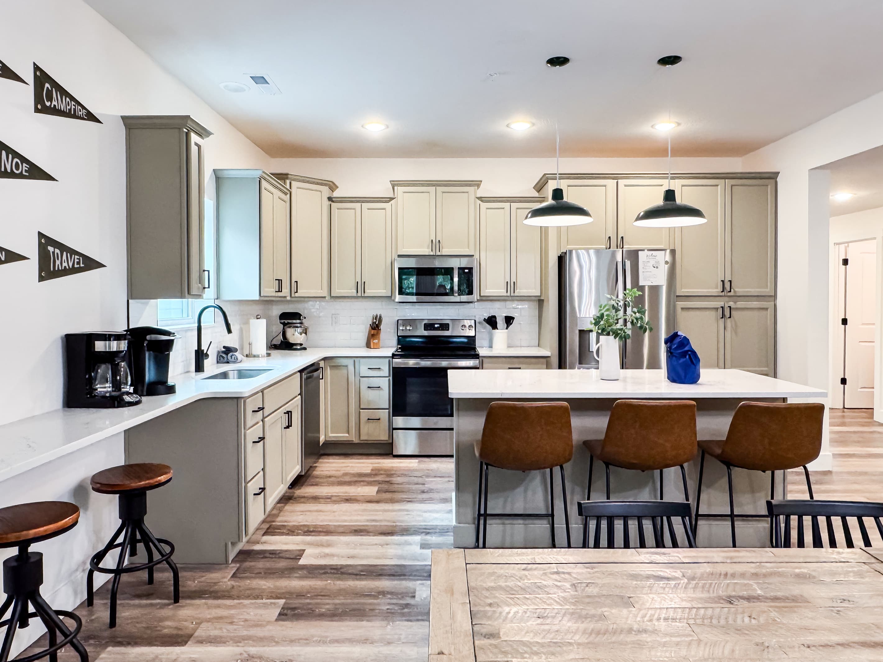 Kitchen with island providing more seating