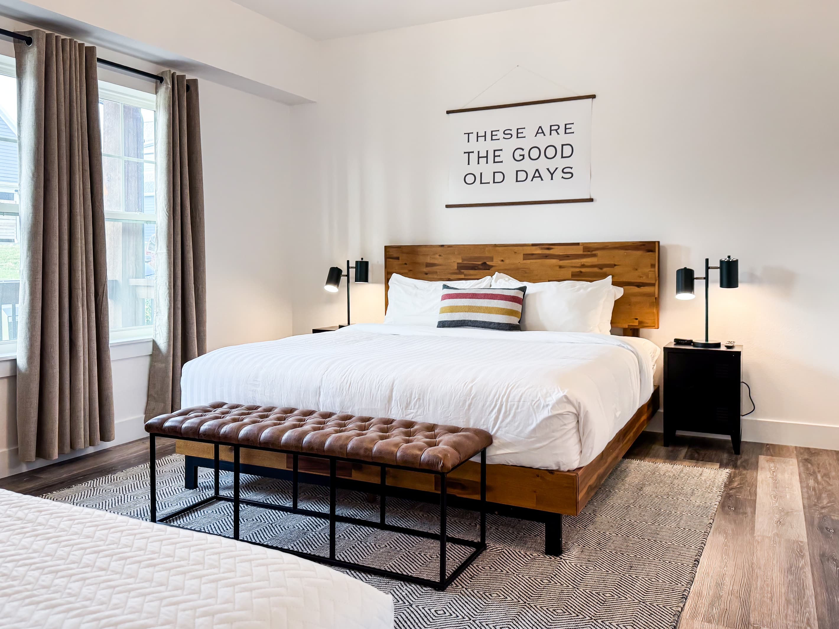 Bedroom 1 (main level): King bed with two nightstands with twin bed