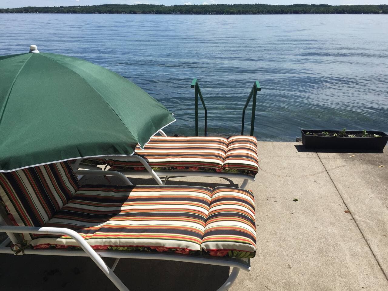 Lakefront in front of our home.  Great view.  Chairs in summer (spring and fall possibly).