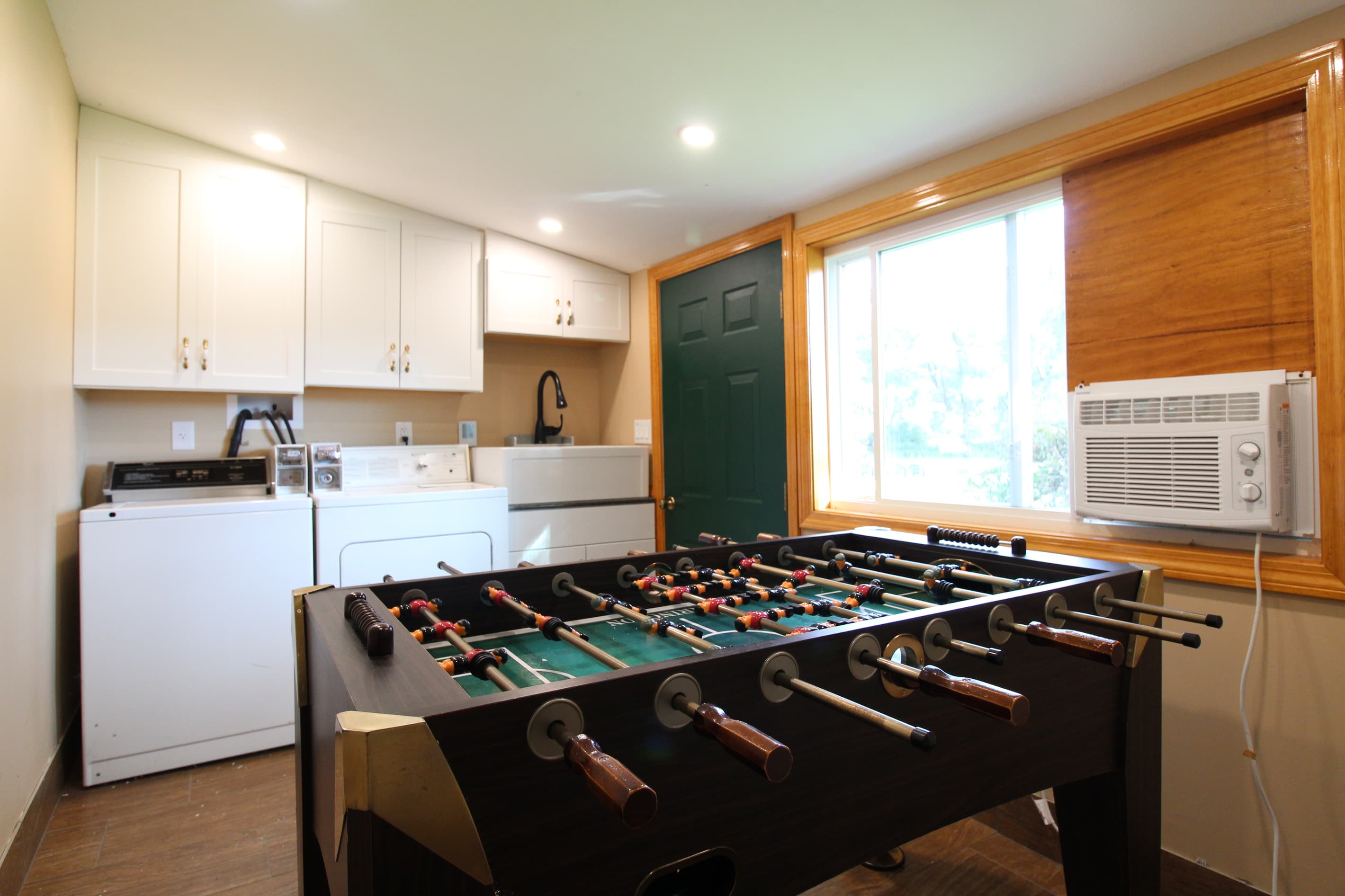 Combo second laundry area and game room