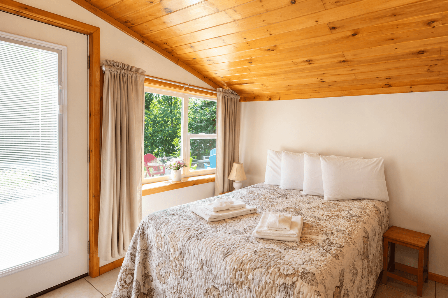 Bedroom #1 with full bed and views of the lake