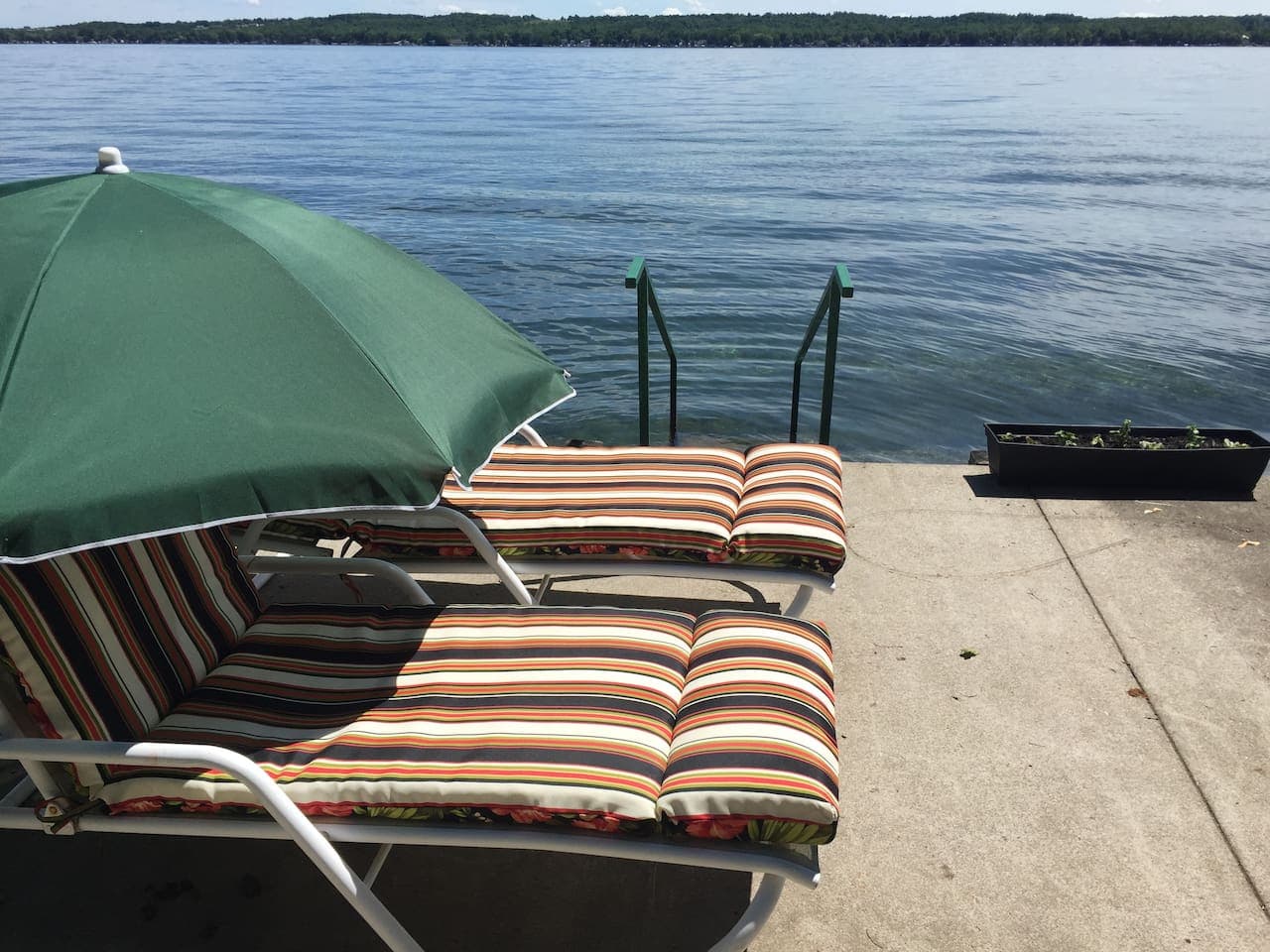 Lakefront in front of our home.  Great view.  Chairs in summer (spring and fall possibly).