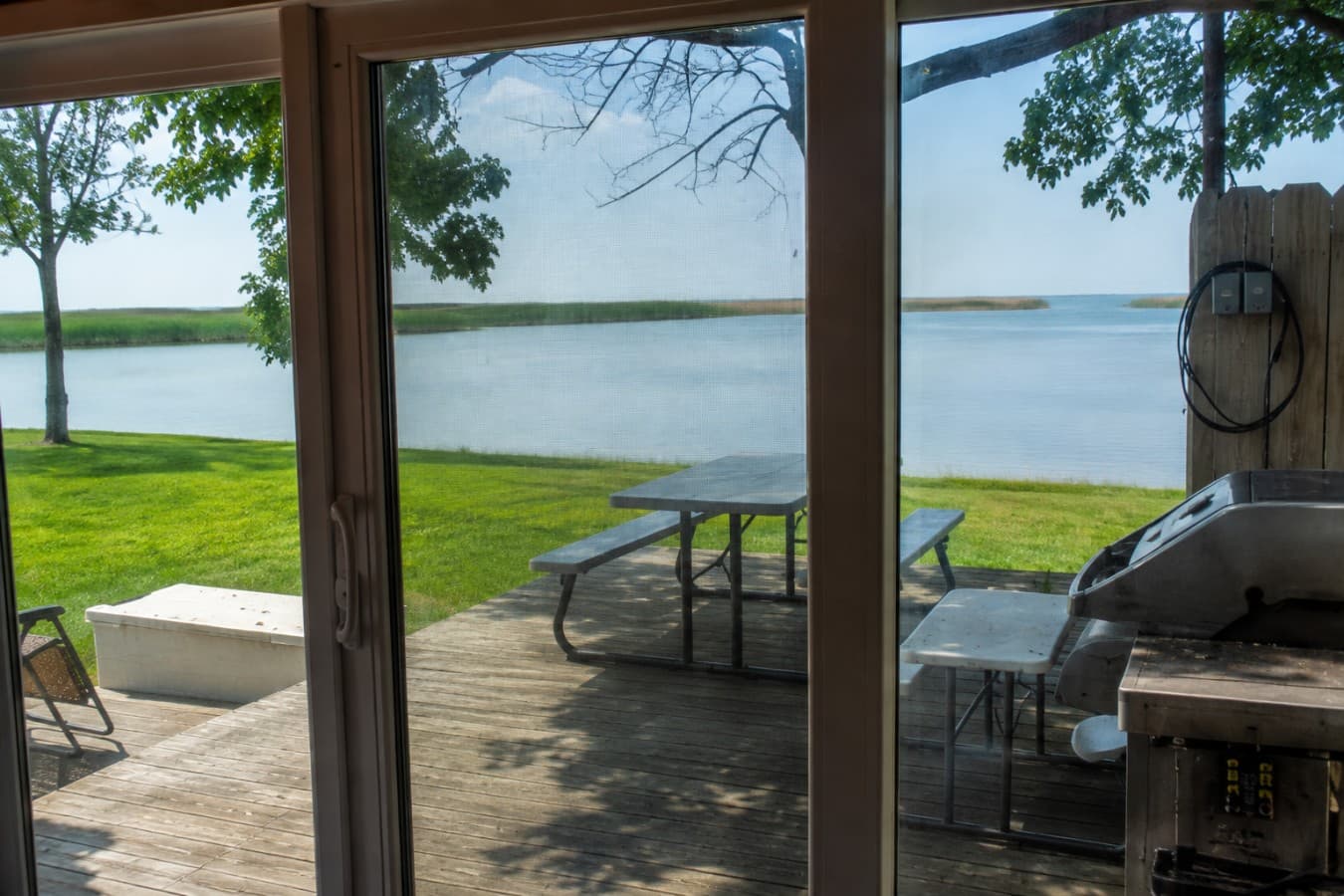 Cozy Home I view of the lake from inside the cabin.png