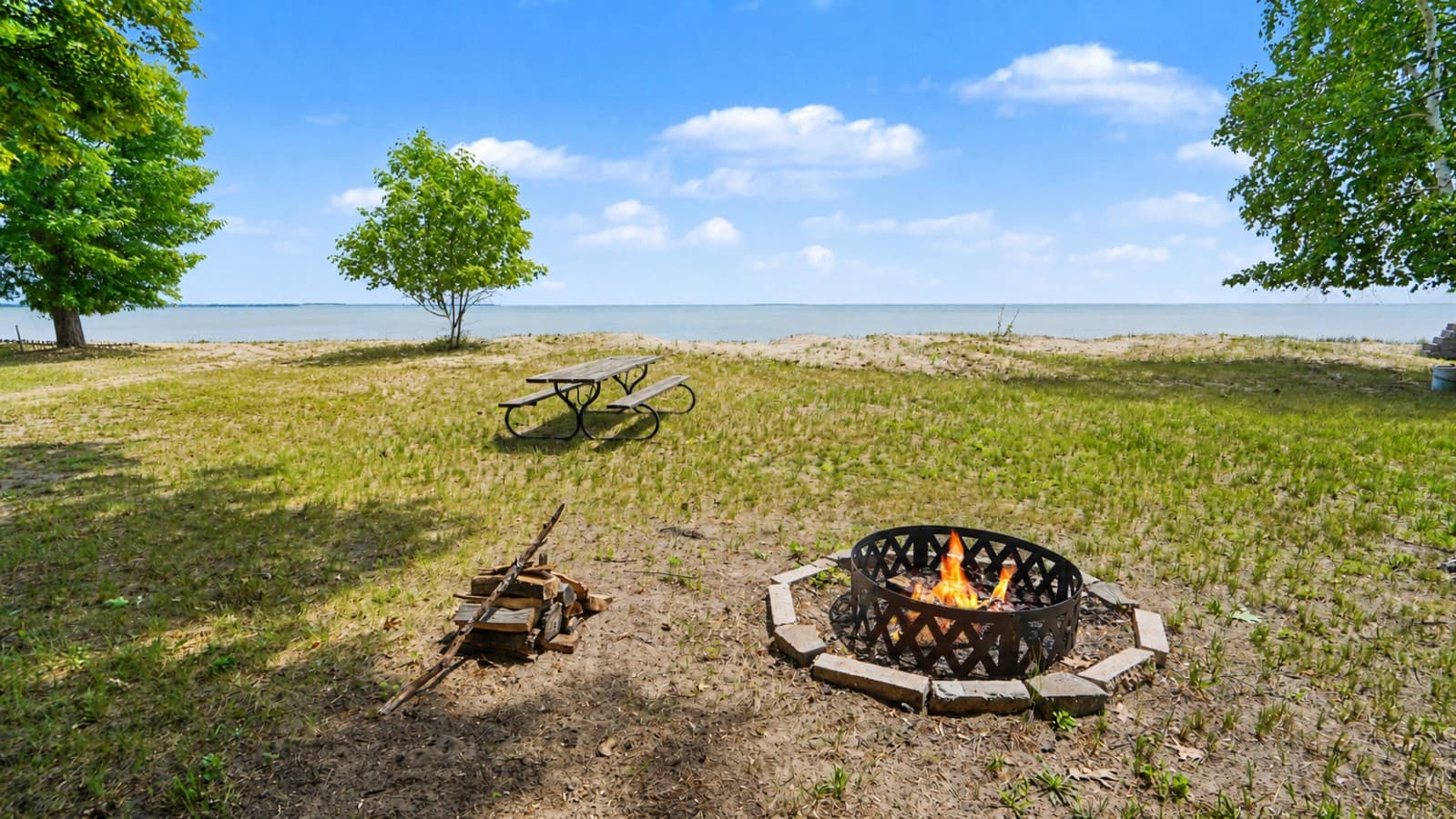 Granny's Cabin fire pit and lake view.png