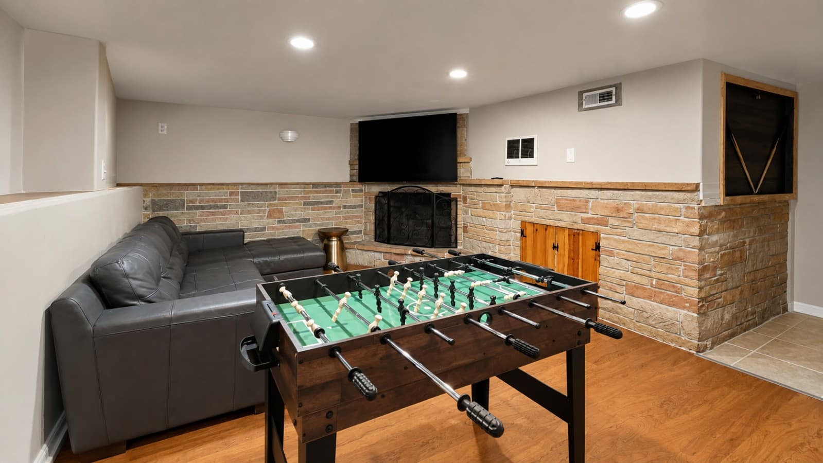 Challenge your friends or family to a foosball match, then relax on the sectional and enjoy a movie..png