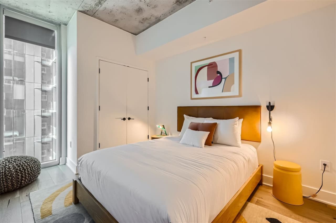Second bedroom featuring a queen size bed.