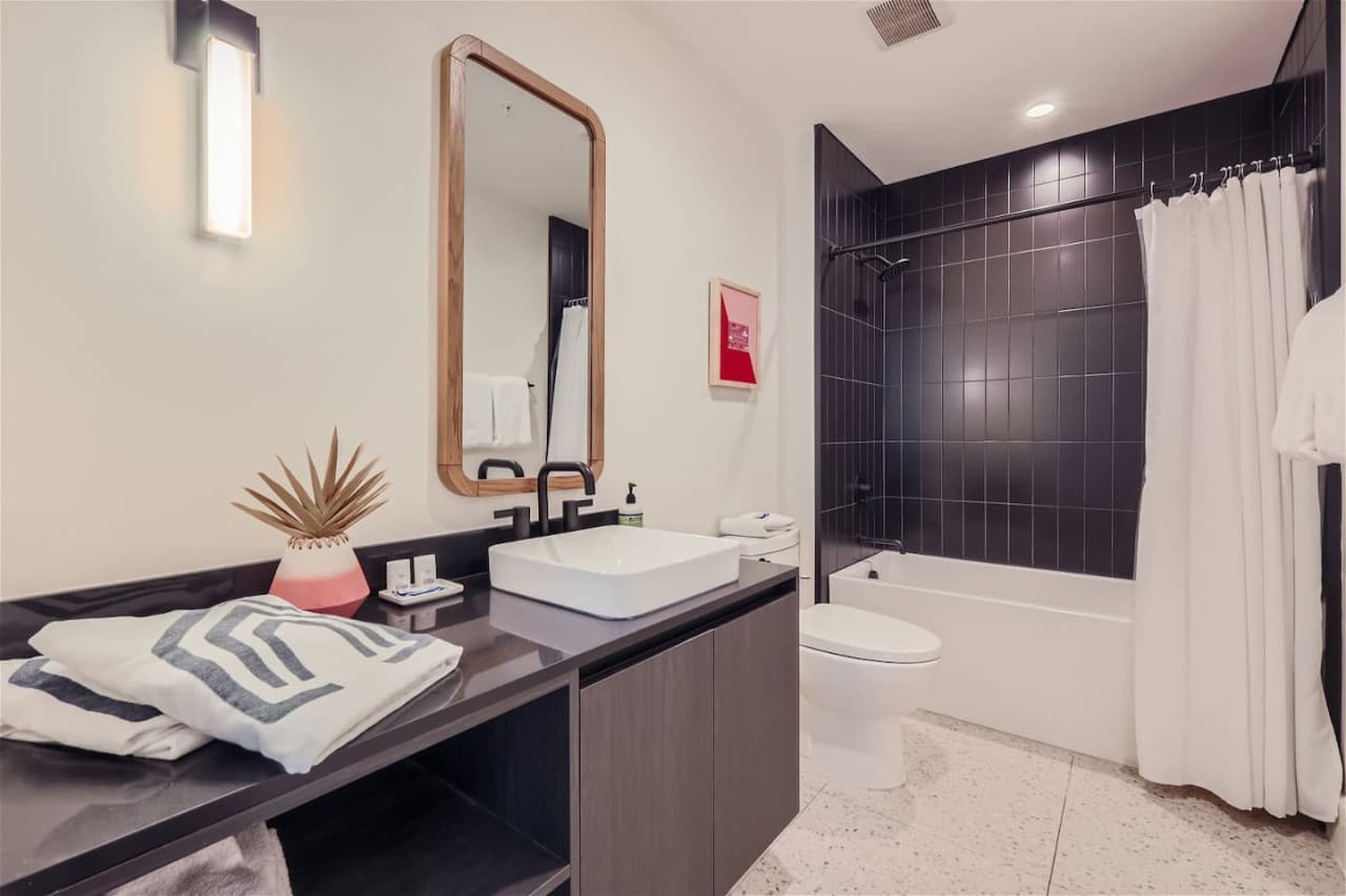 Second bathroom with a shower/tub combination.