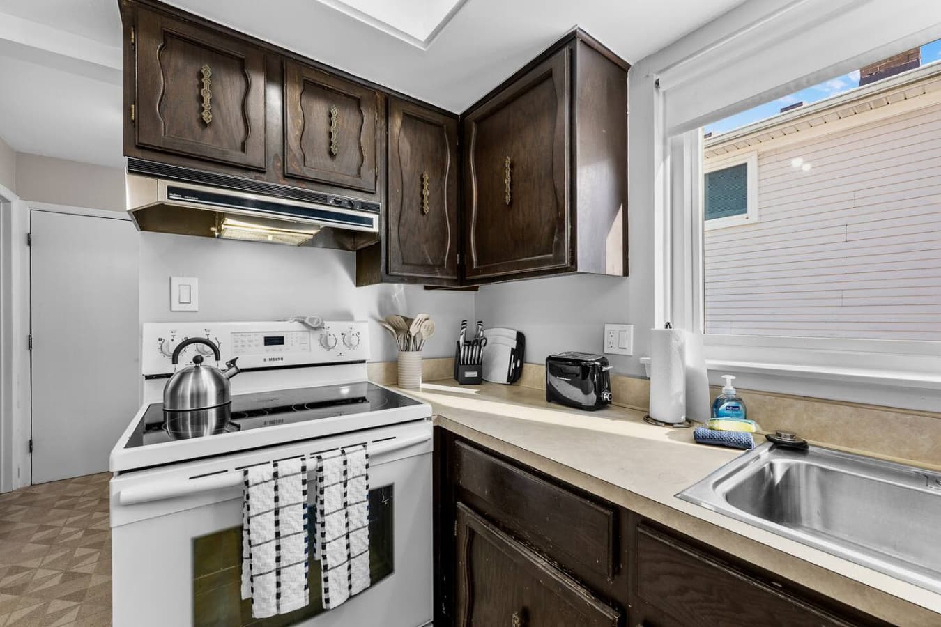 A bright kitchen with essential appliances for everyday cooking.
