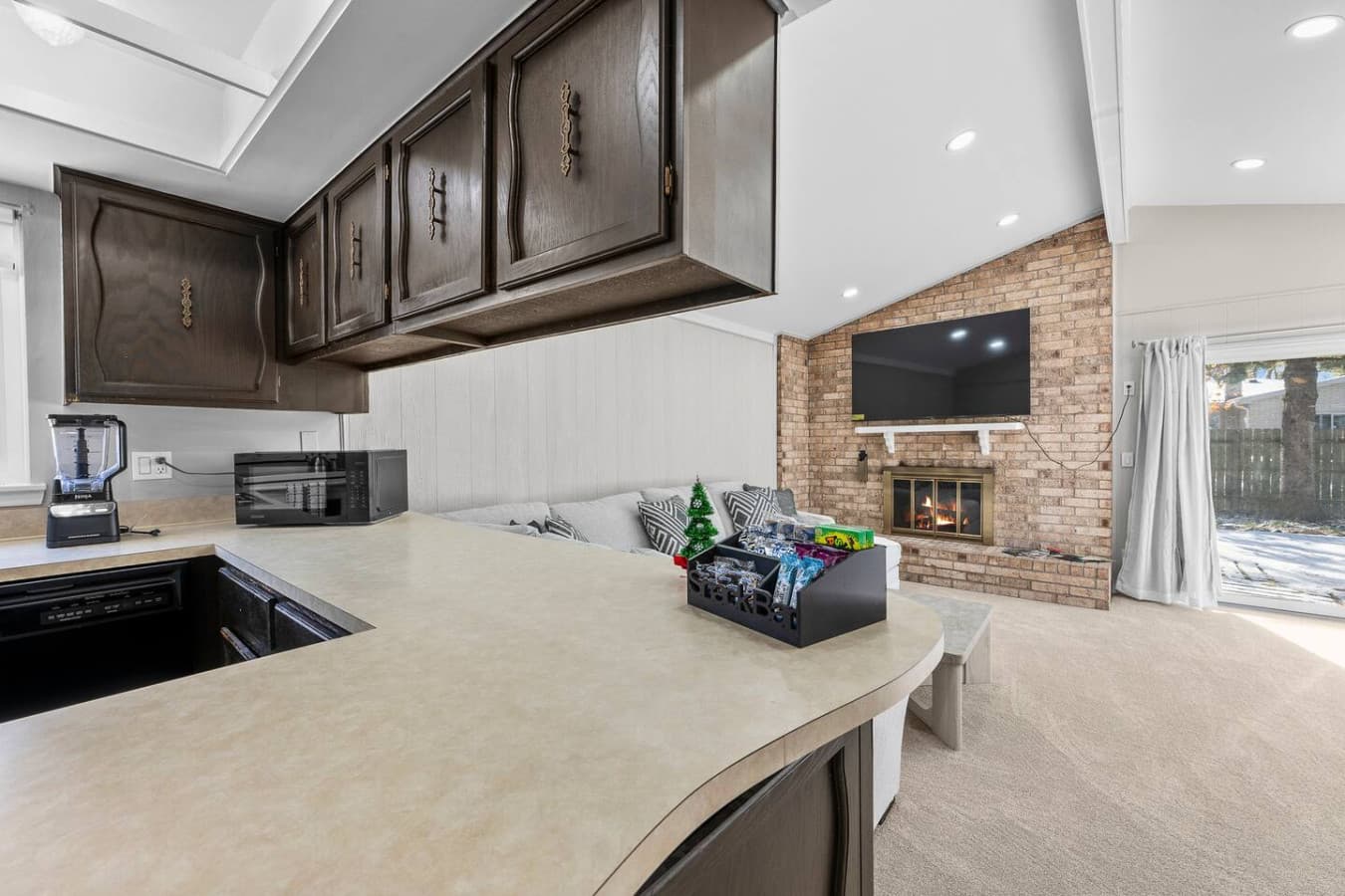 A spacious counter area overlooking the living room for easy interaction.