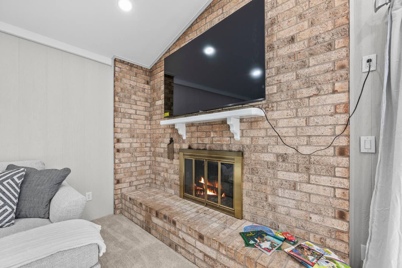A close view of the fireplace creating a warm and inviting focal point.