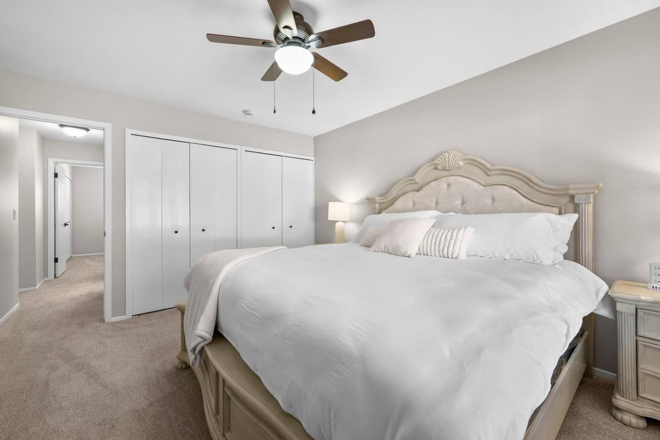 A spacious bedroom with ample storage and a peaceful atmosphere.