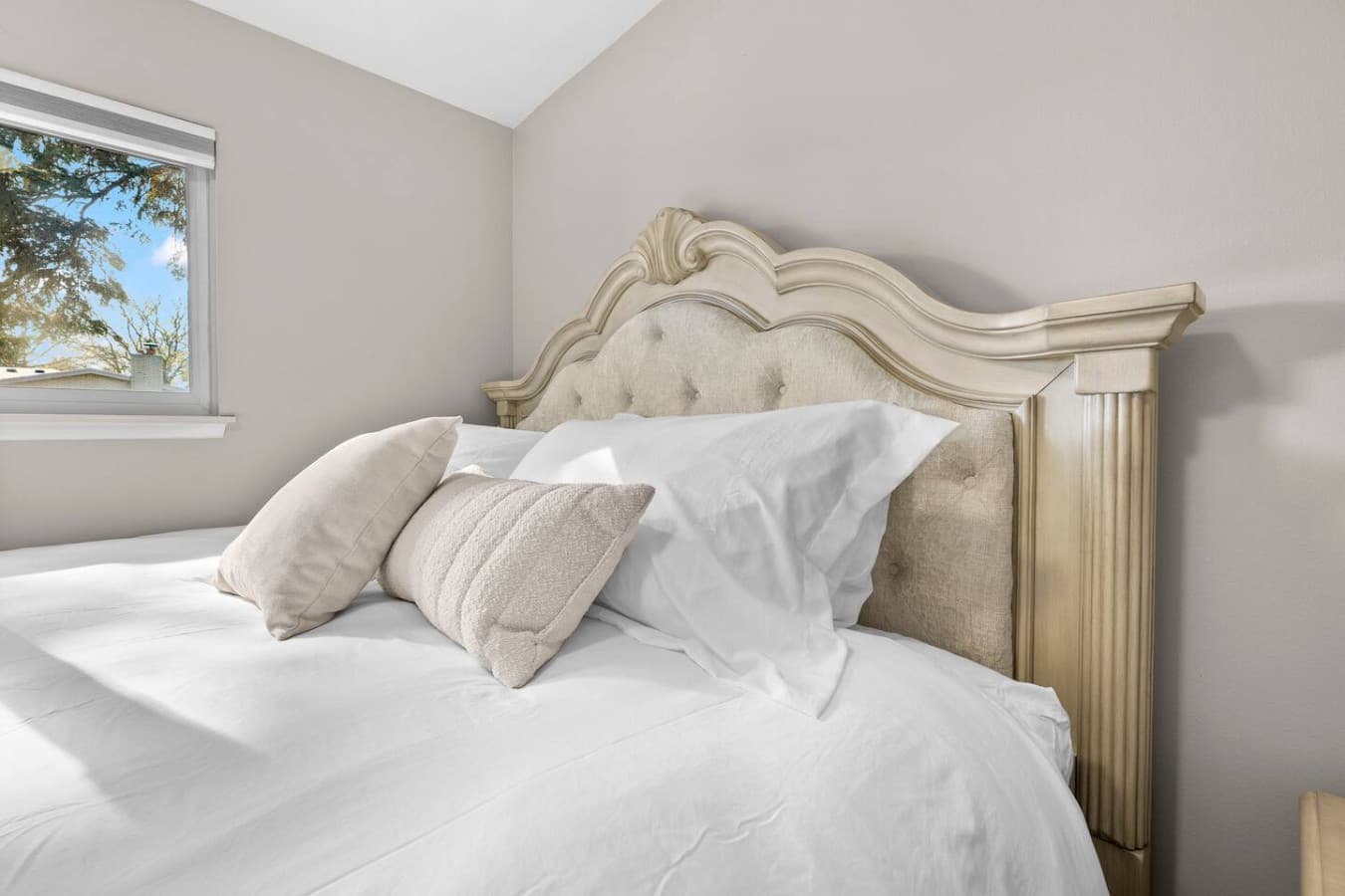A close view of the plush pillows and fresh linens for a restful stay.