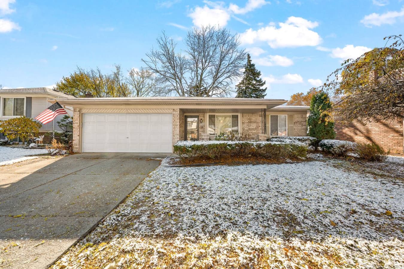 A clear view of the home’s front entrance and well kept landscape.