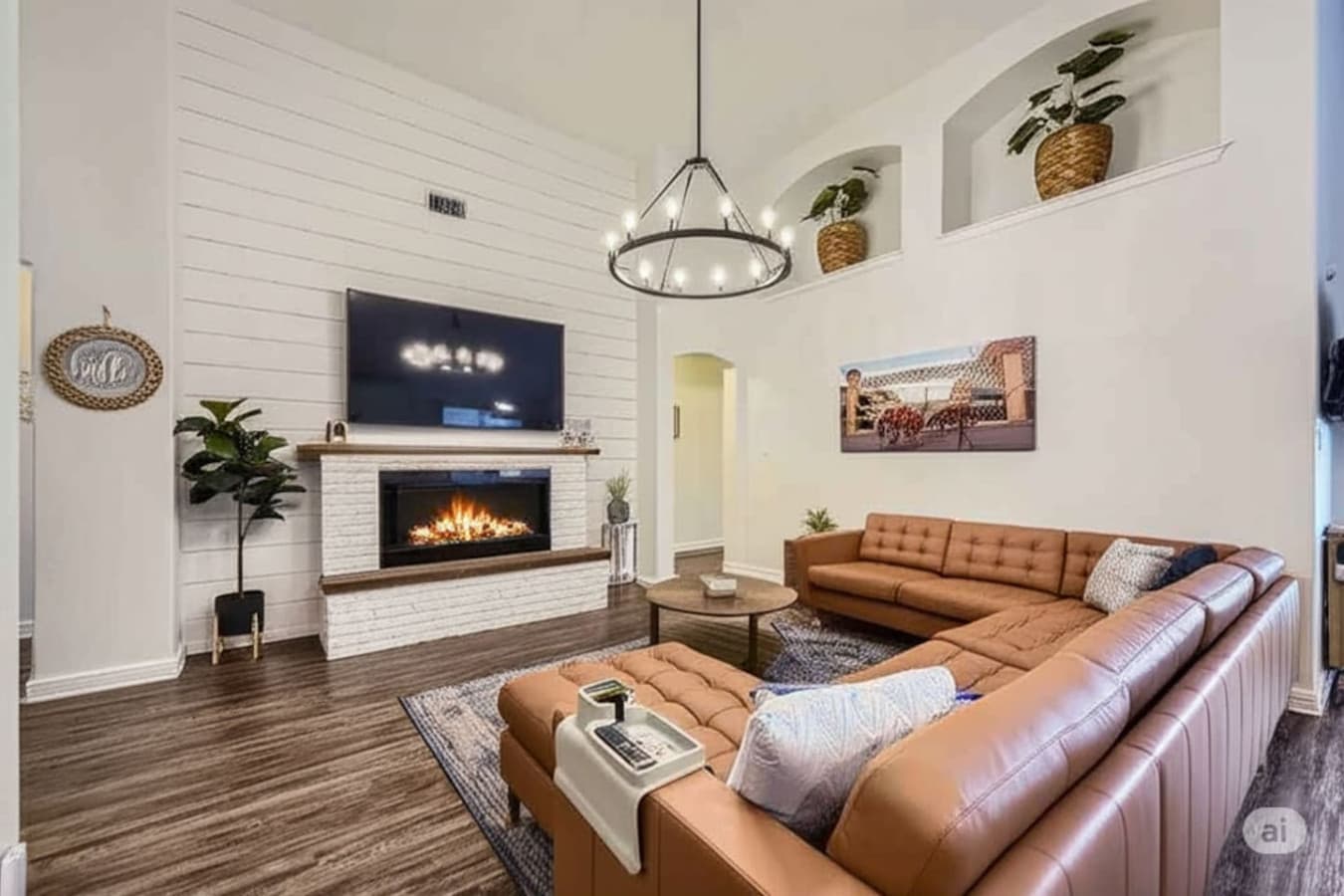 Electric fireplace and oversized sectional featured in the spacious living room space.