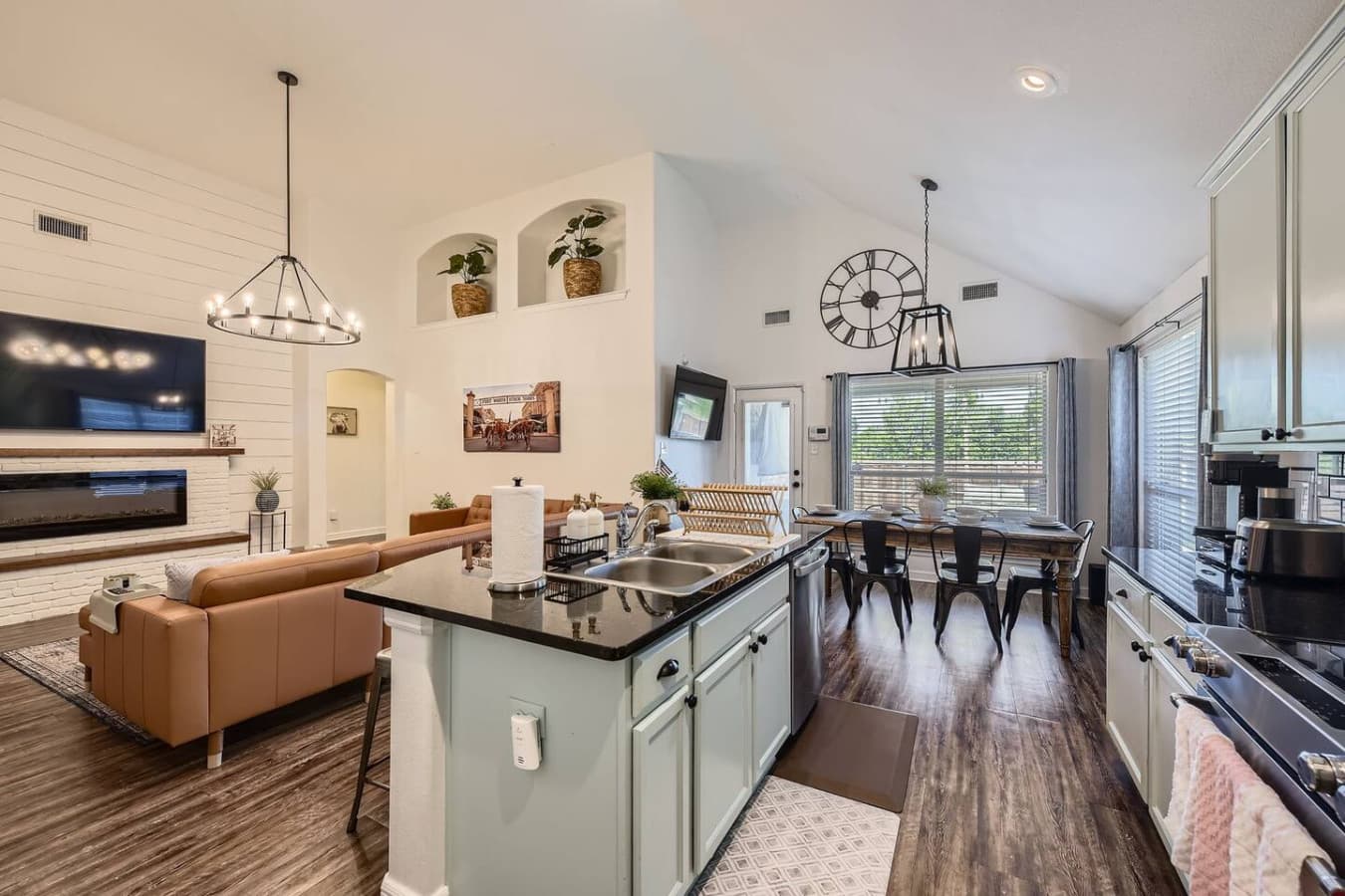 Open concept kitchen, dining room and living room space.