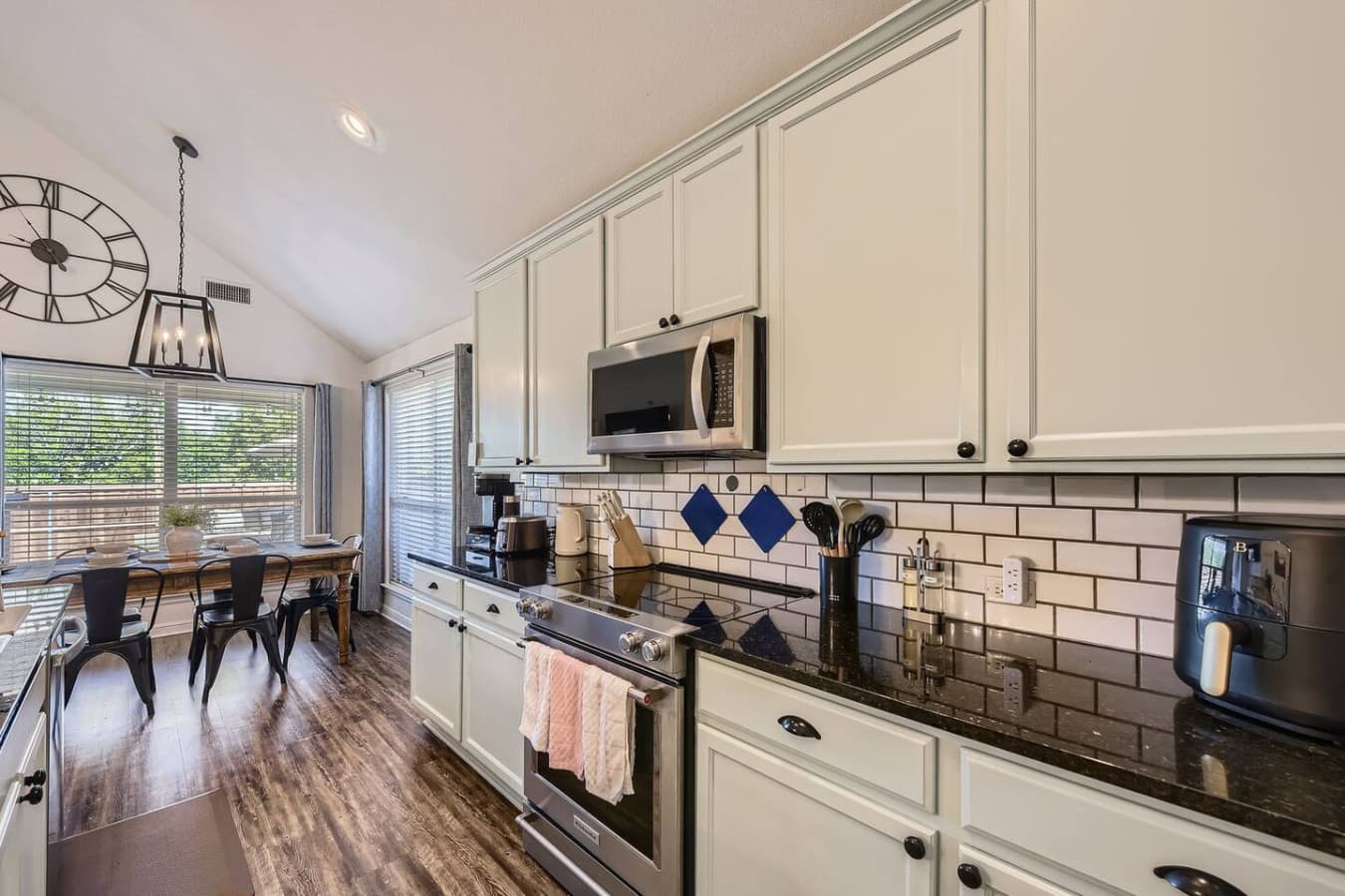 Whip up delicious meals in your chef-ready kitchen, boasting gleaming stainless steel appliances and a chic subway tile backsplash.