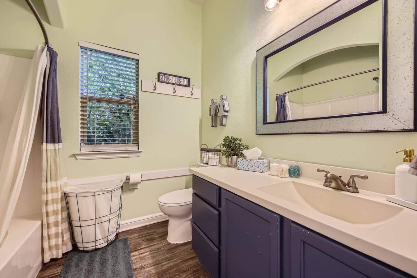 Full bathroom with tub shower combination.