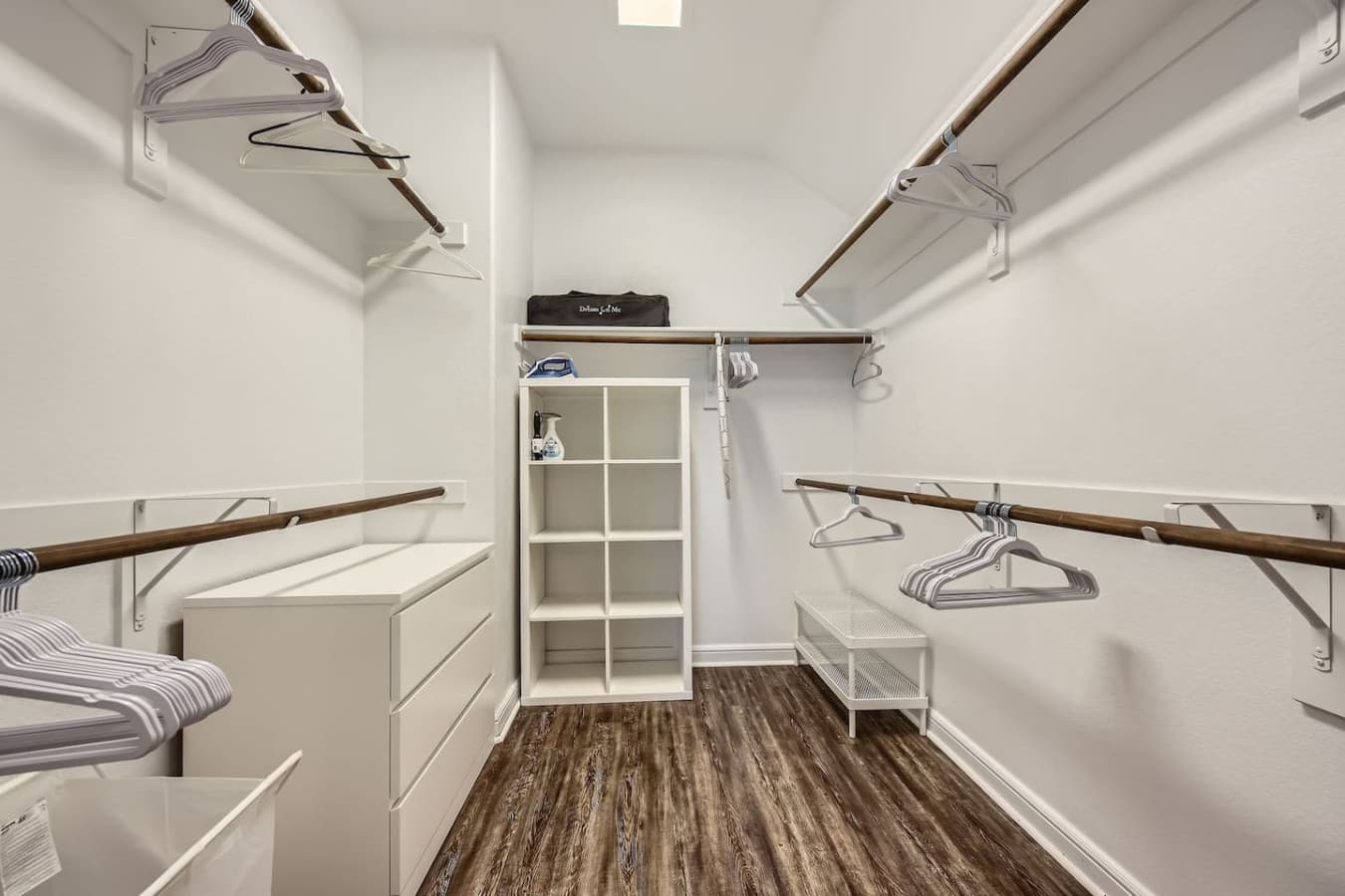 Walk in closet in the primary bedroom.