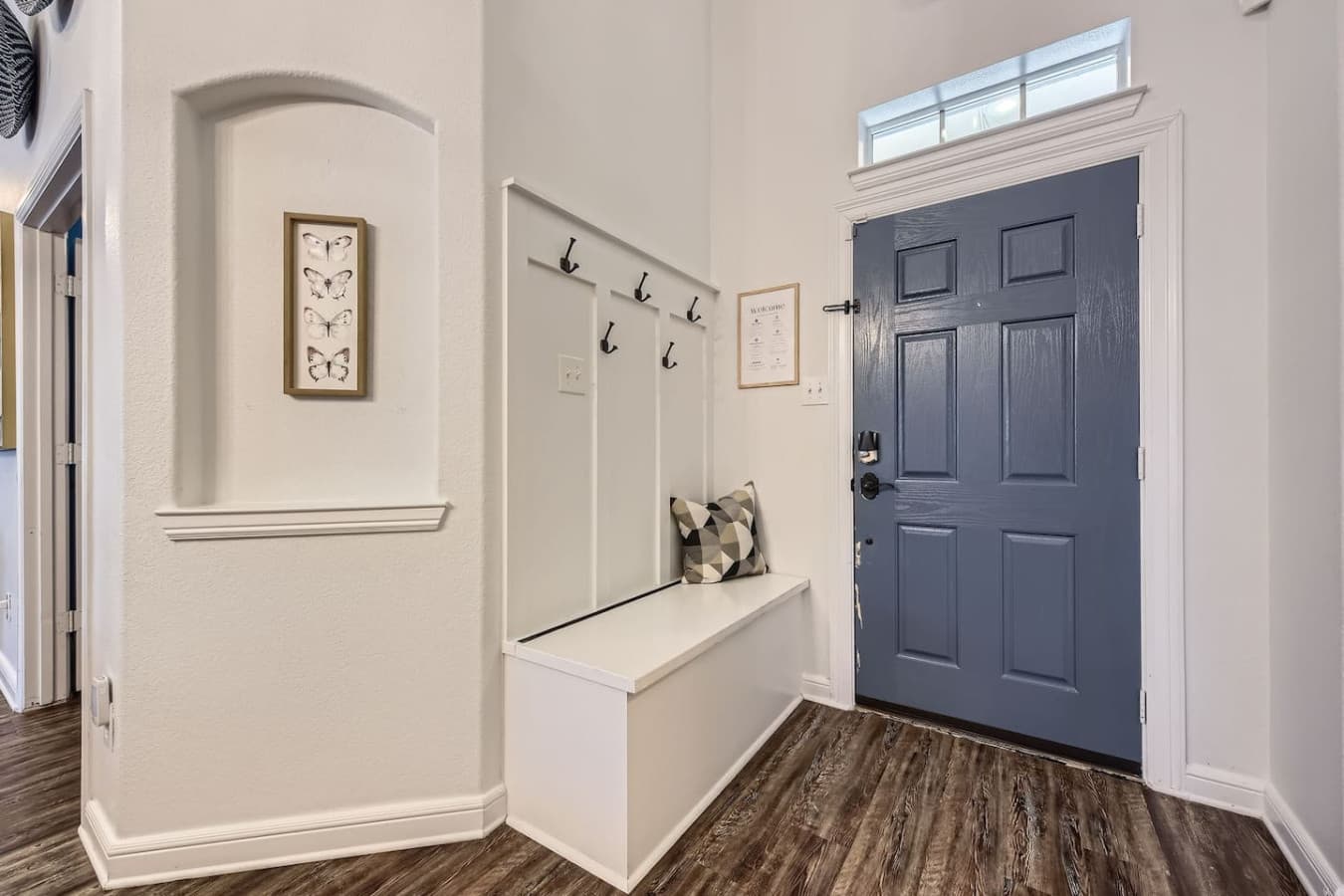 Entry way featuring coat hangers.