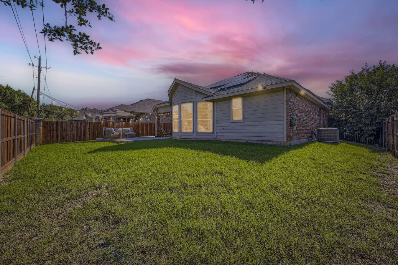 Fully fenced landscaped backyard space.