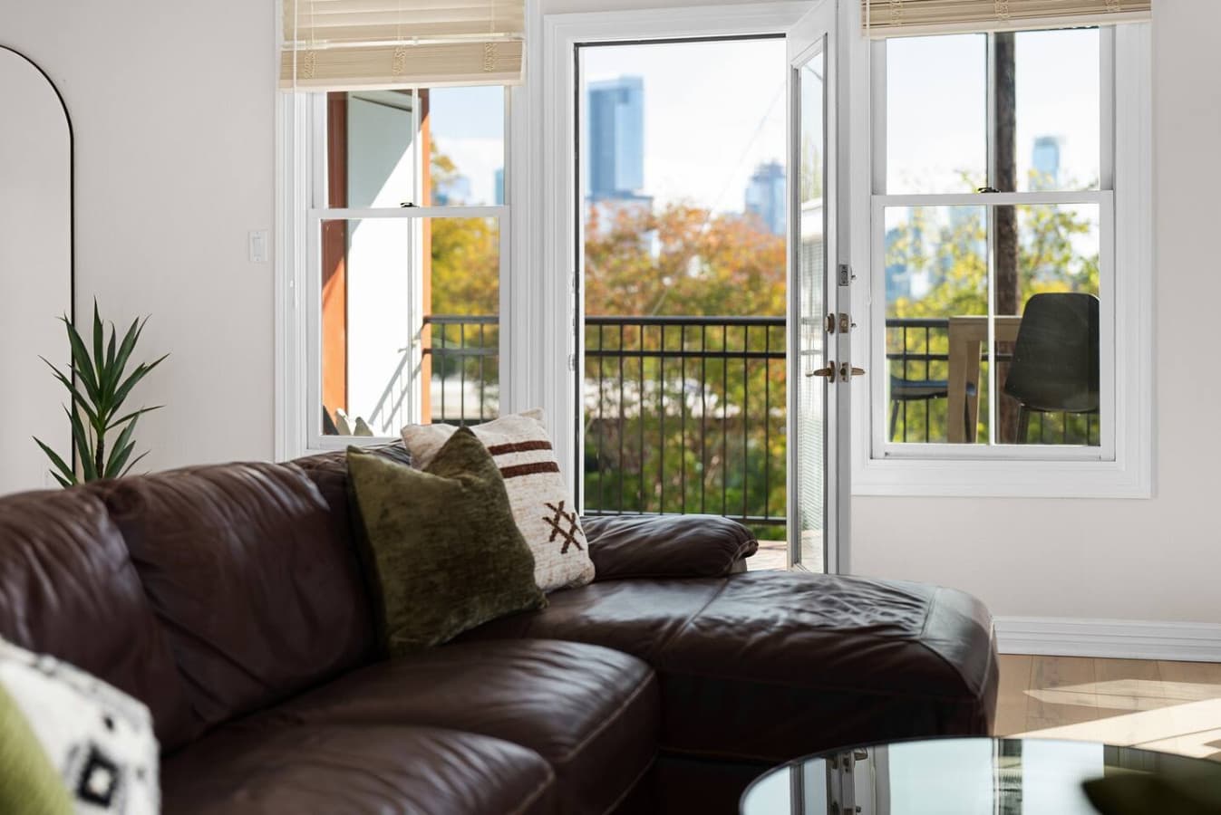 The spacious living room is a stylish haven for relaxation and entertainment. A plush, leather sectional sofa invites you to unwind, while a large, smart TV offers endless entertainment options.