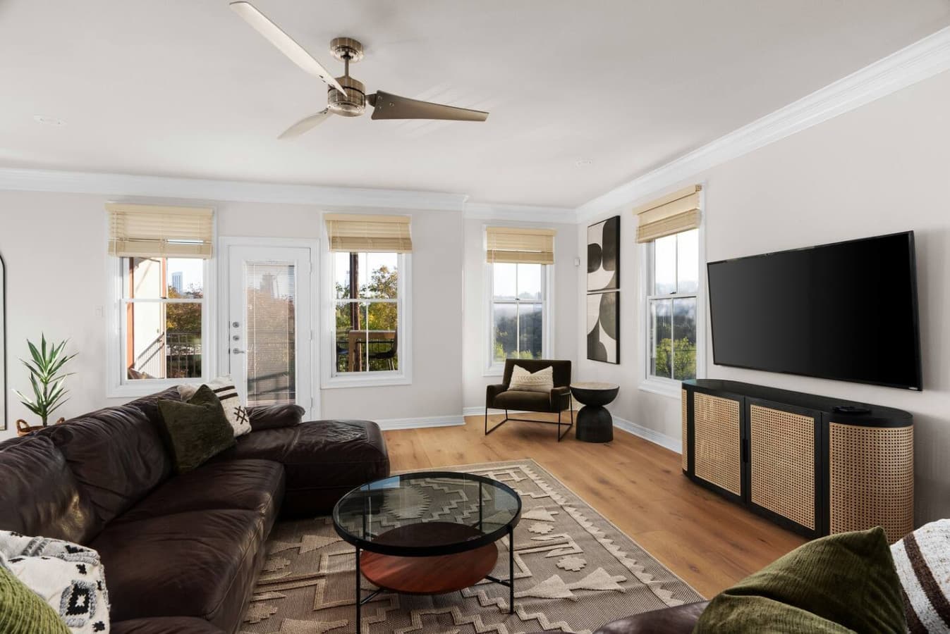 Floor-to-ceiling windows frame stunning city views, bringing the outdoors in.