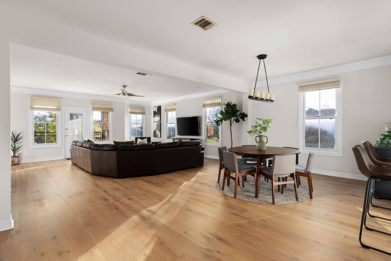 Beautiful wood floors and an open concept kitchen and living room space blend seamlessly to provide you an ample amount of space for your entire crew.