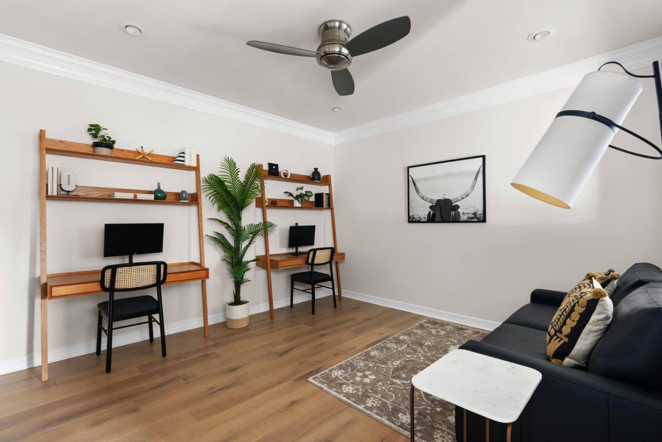 Two workstations in the den featuring monitors, perfect for the remote worker.