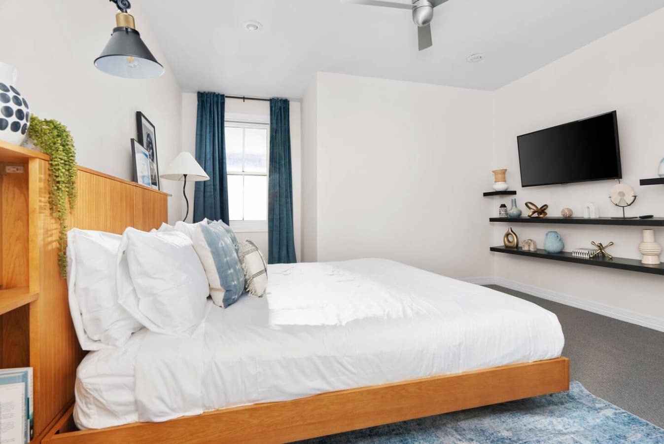 Second bedroom featuring a king size bed and smart TV for streaming.