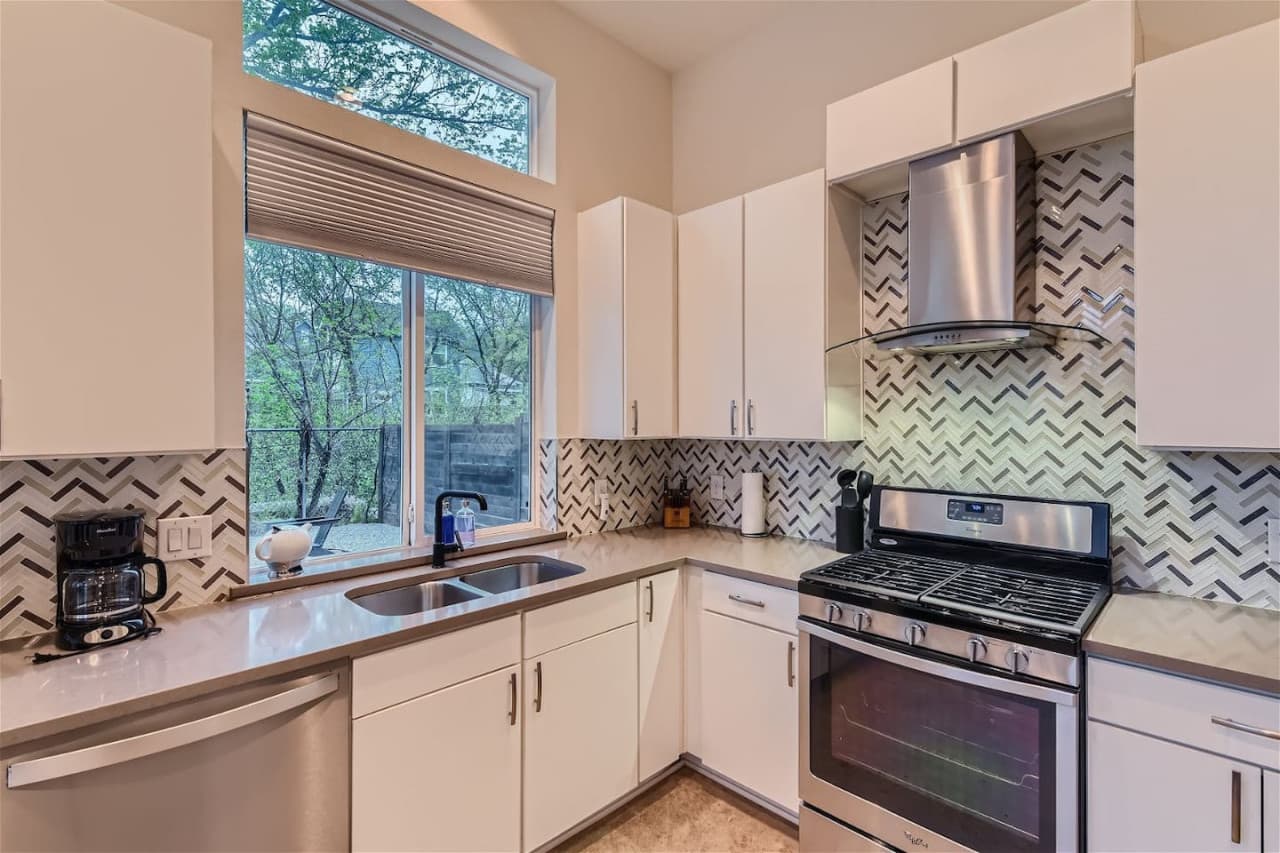 The kitchen boasts updated appliances and plenty of counter space for all your cooking needs.