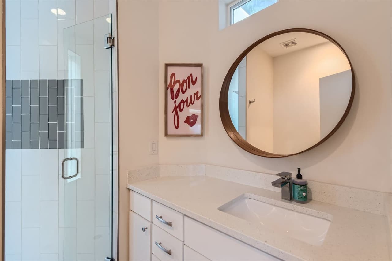 Guest bathroom featuring a step-in shower.
