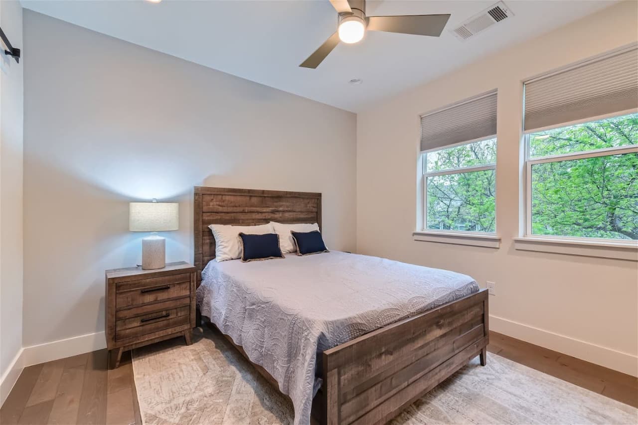 The master bedroom benefits from an exclusive attached bathroom and a queen size bed.