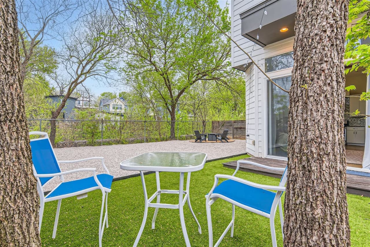 Spend quality time with friends and family in the spacious outdoor area, equipped with comfortable seating and a fire pit.