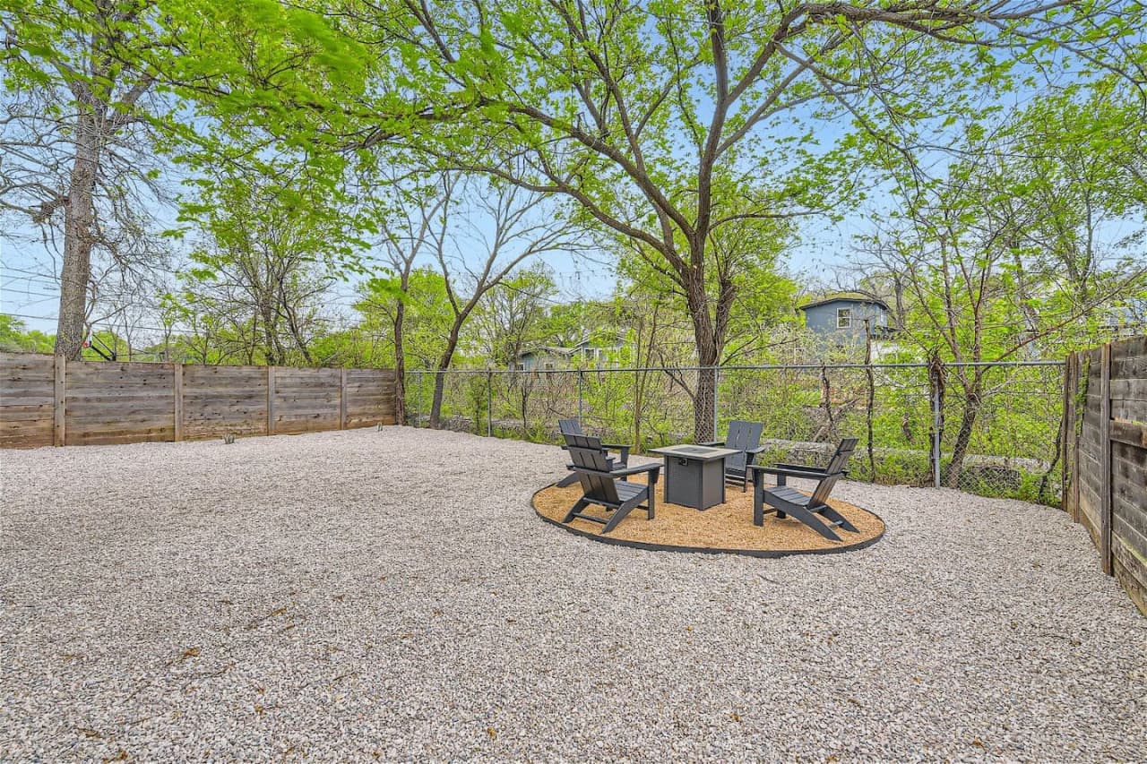Outside, the backyard is a peaceful oasis where you can unwind and roast marshmallows around the fire pit.