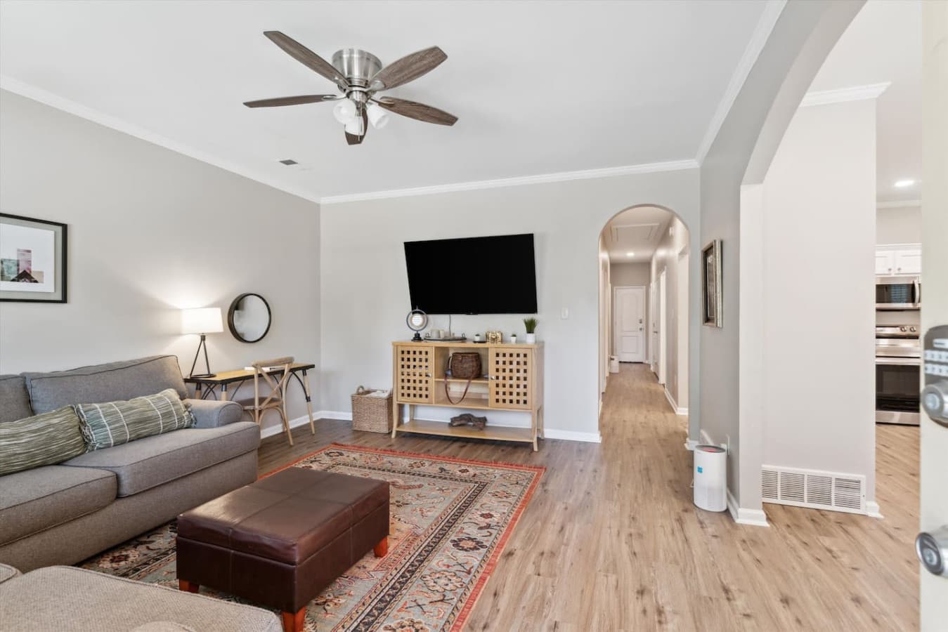 Living room featuring a sectional and Smart TV for streaming.