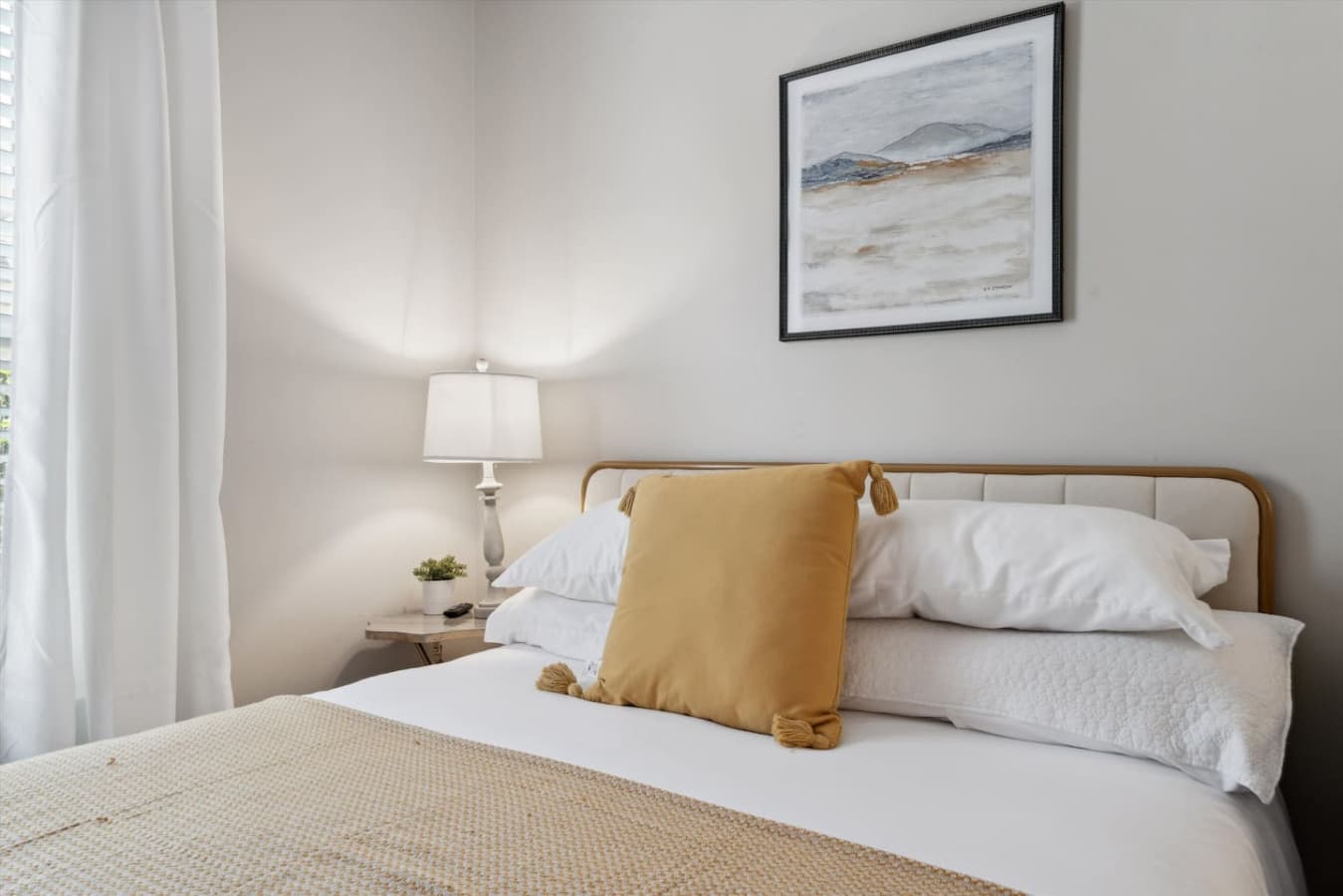 Queen bed featured in the third bedroom.