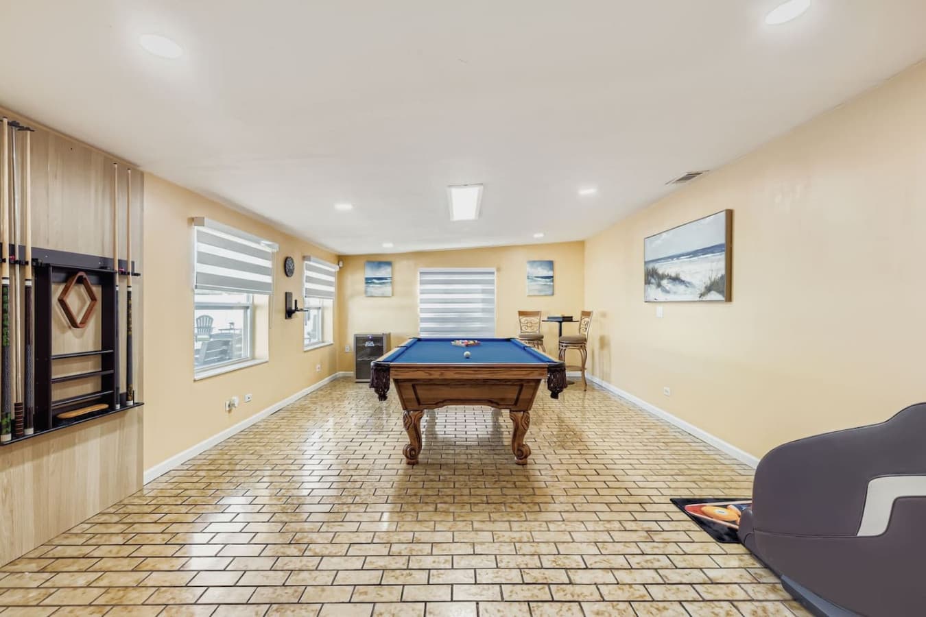 Challenge your friends to a game of pool in this bright and inviting recreation space.