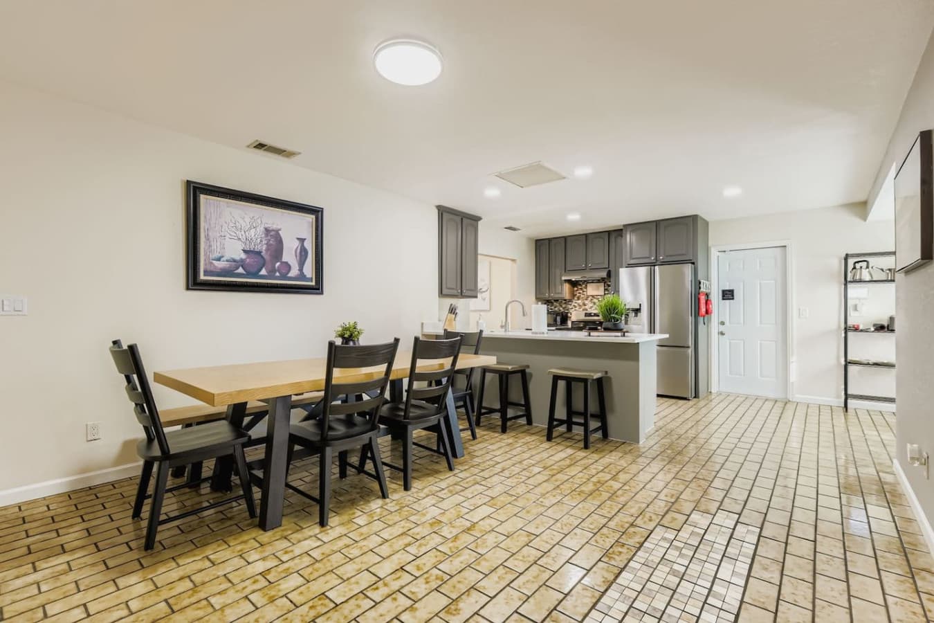 Dining table right next to the kitchen, making preparing and serving a breeze.