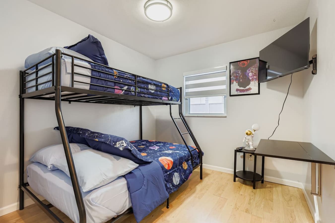 The second bedrooms features a bunk bed set and smart TV.