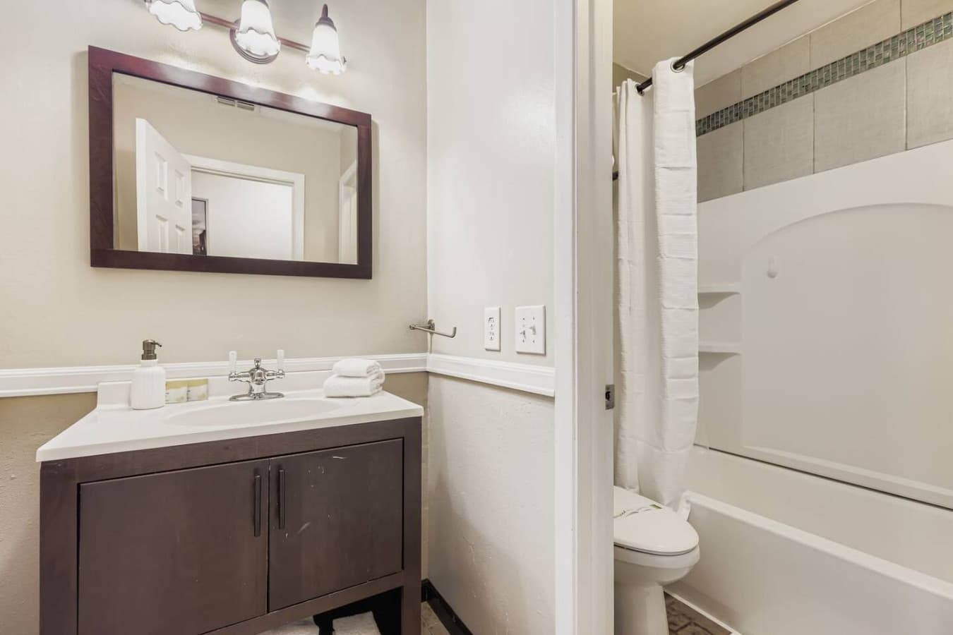 Second bathroom with shower/tub combo.