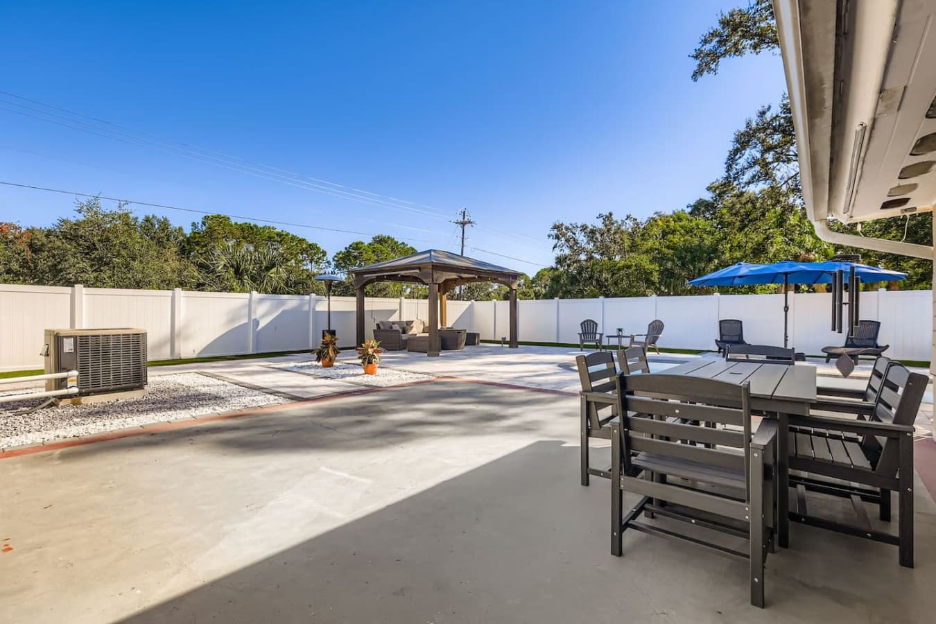 Spacious outdoor area made for gatherings, enjoy al fresco dining, sun-soaked lounging, or peaceful evenings in this fully fenced, private retreat.