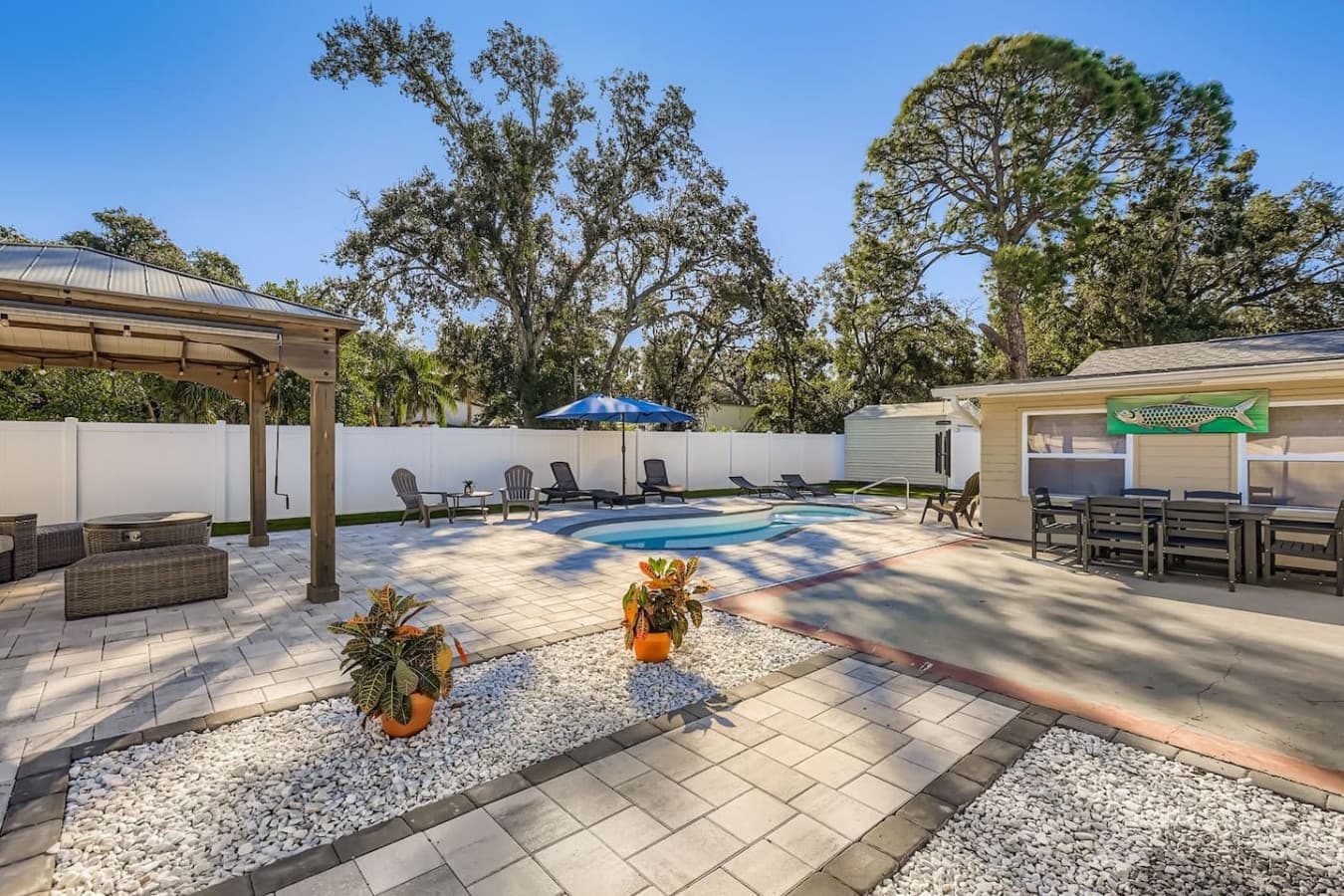 Cool down under the pergola or enjoy a peaceful moment in this Zen-like corner of the yard.